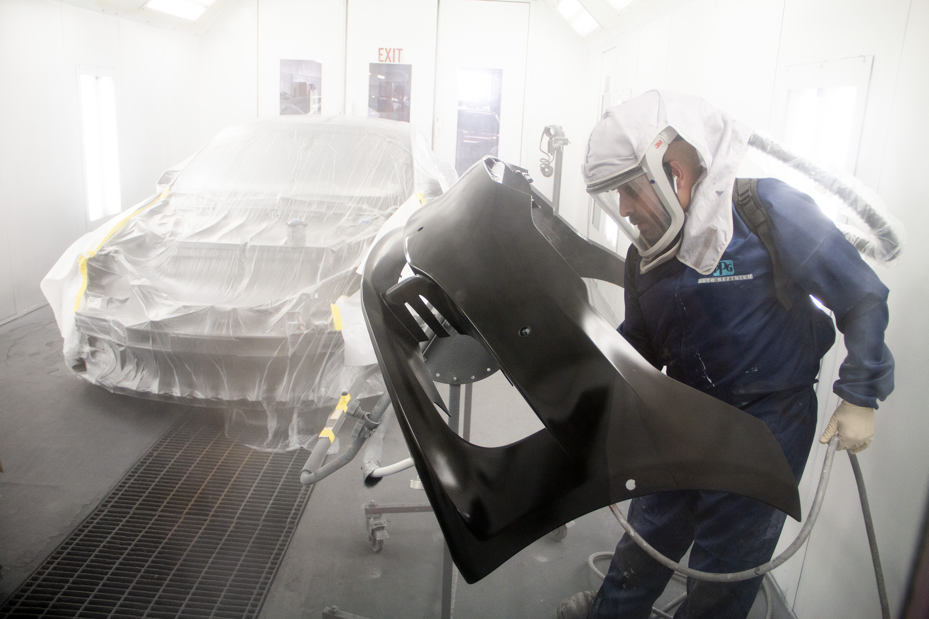 Worker Painting Car