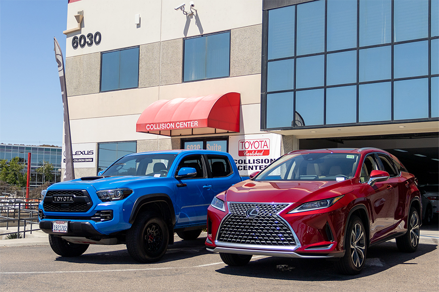 A Toyota and a Lexus in front of Toyota Carlsbad Collision Center